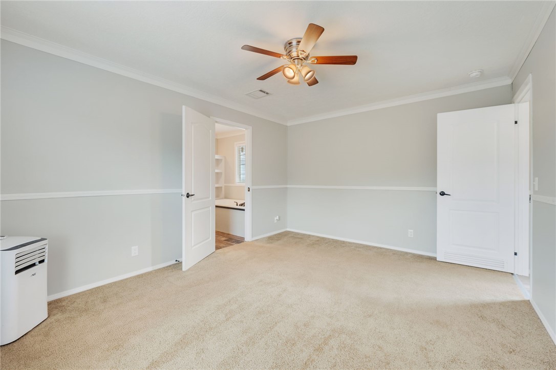 9144 Hensarling Lane Bryan, TX 77808 - Photo 15 of 25 a view of a livingroom with a ceiling fan