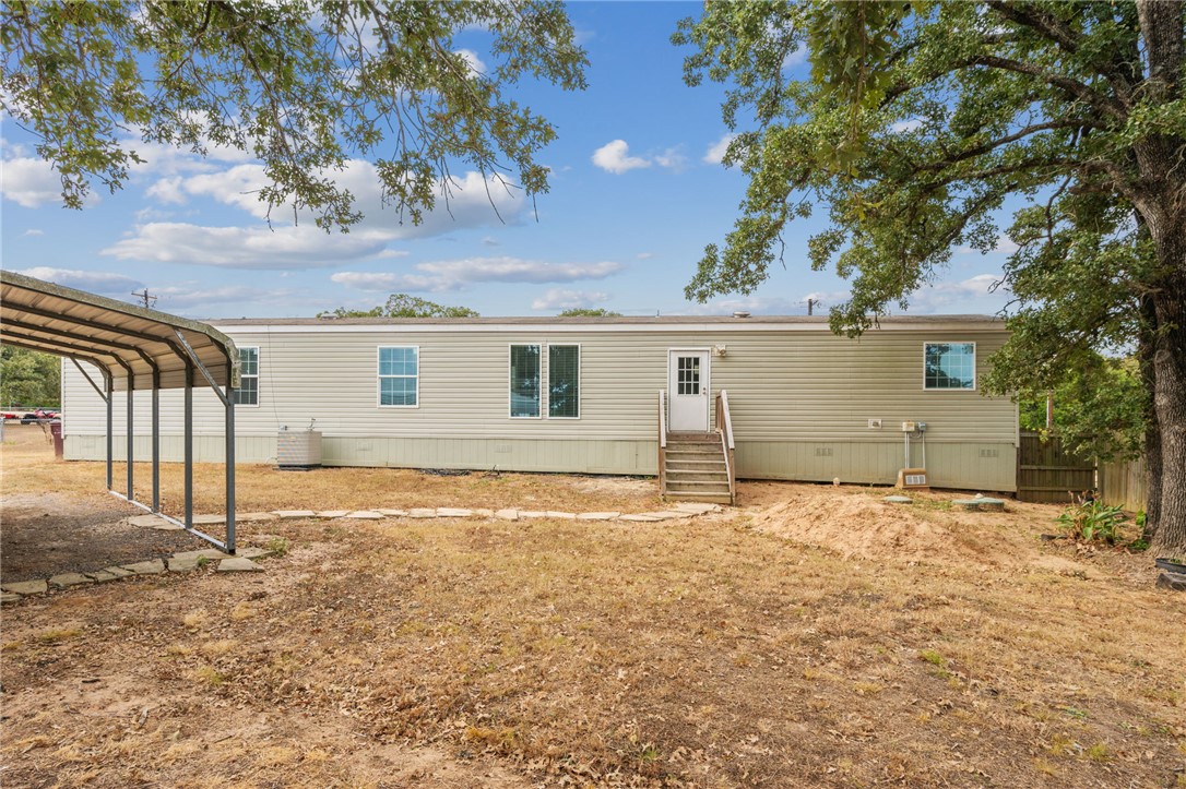 9144 Hensarling Lane Bryan, TX 77808 - Photo 20 of 25 a front view of a house with a yard