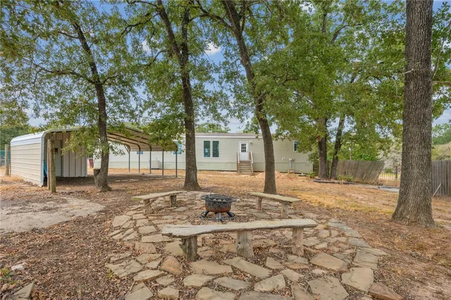 a house with trees in front of it