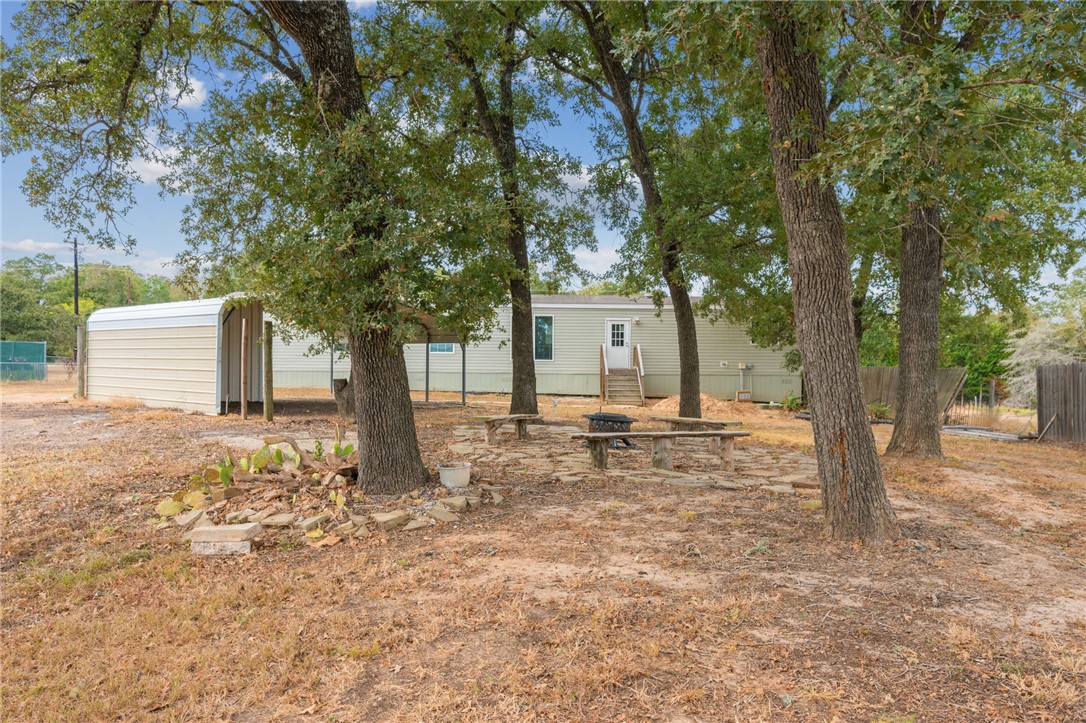9144 Hensarling Lane Bryan, TX 77808 - Photo 23 of 25 a view of a house with a yard