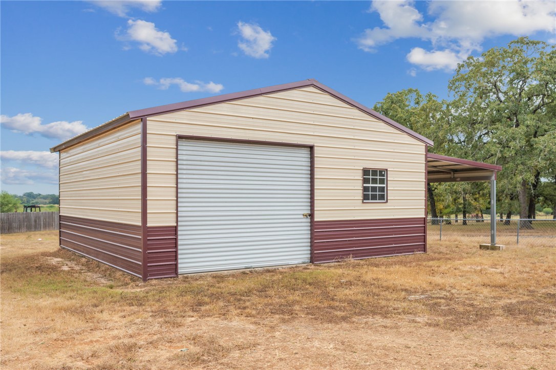 9144 Hensarling Lane Bryan, TX 77808 - Photo 24 of 25 a view of a house with a backyard