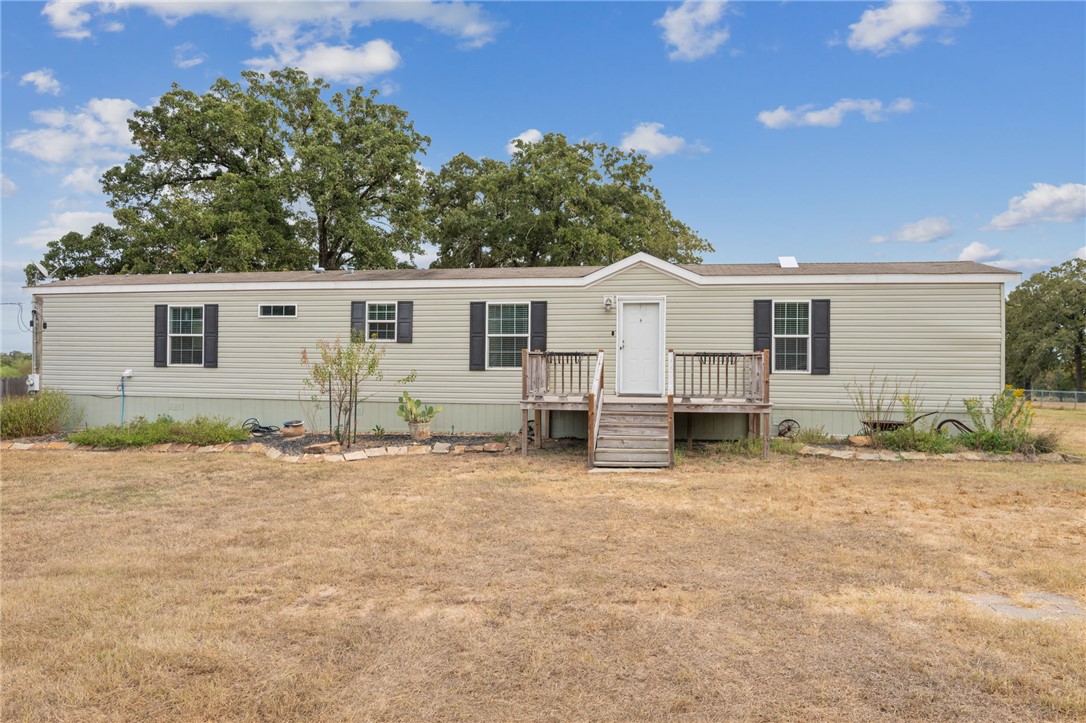 9144 Hensarling Lane Bryan, TX 77808 - Photo 4 of 25 a view of a house with backyard and sitting area