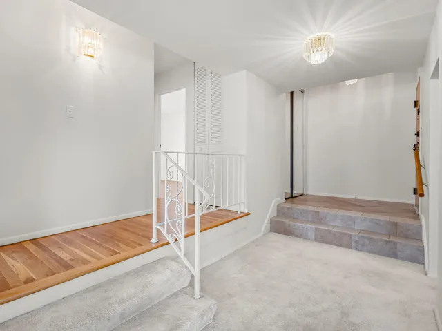 a view of an empty room with a ceiling fan