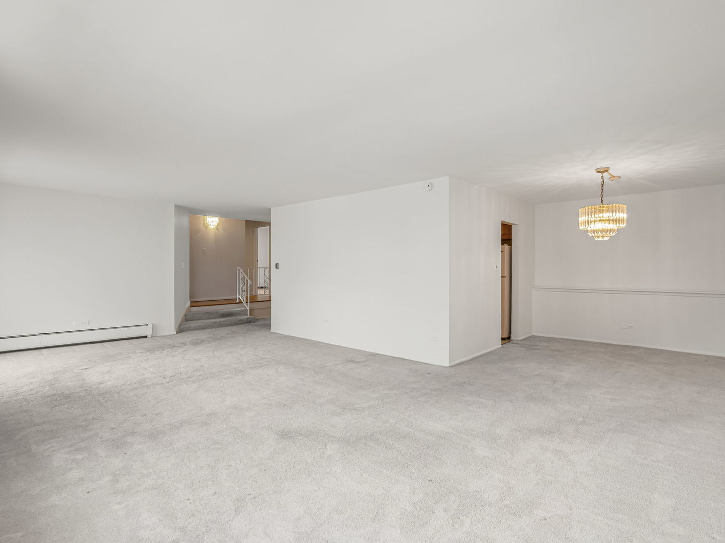 9009 Golf Road, Unit 2A Des Plaines, IL 60016 - Photo 3 of 18 an empty room with a projector and cabinets