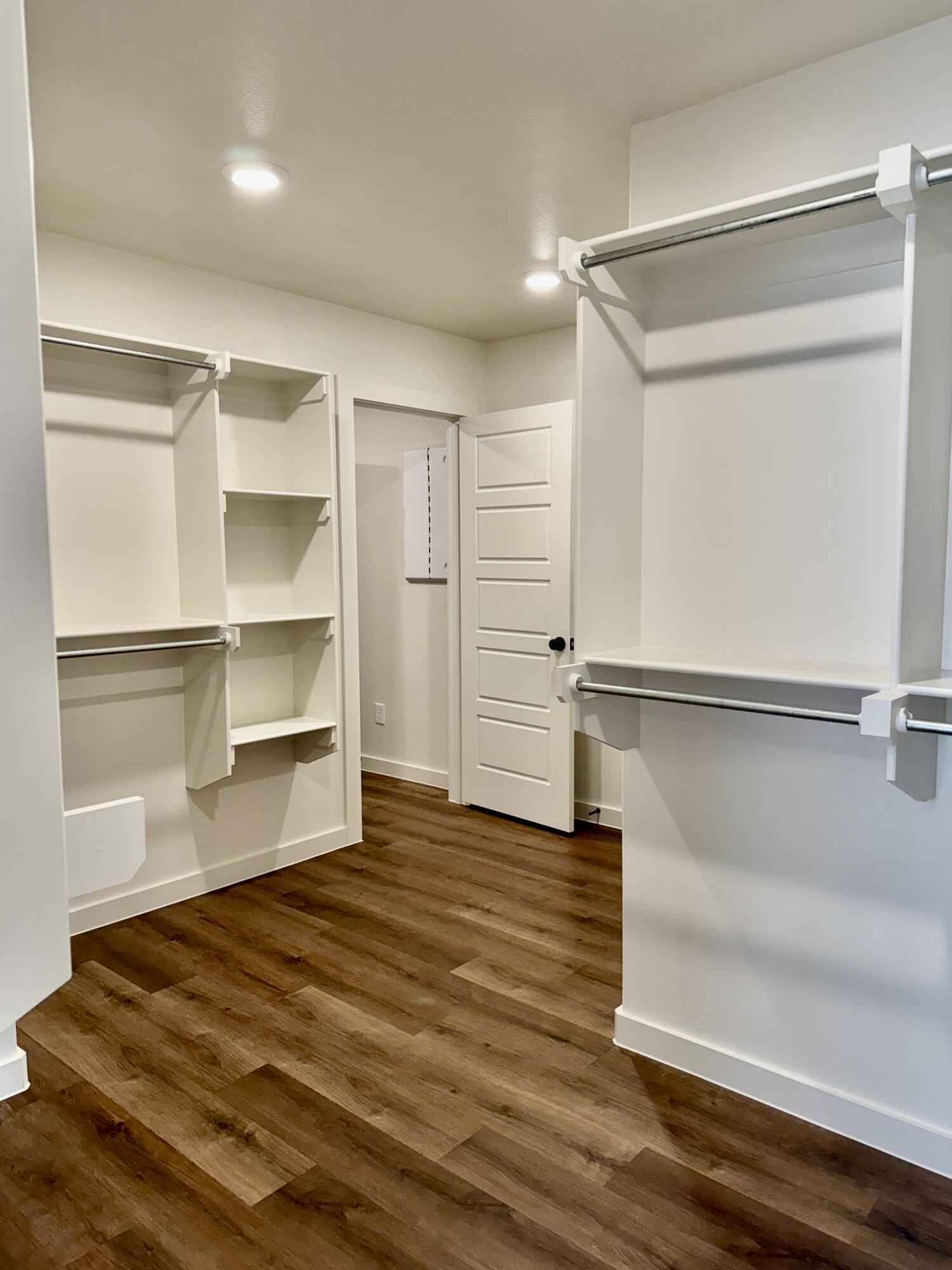 7007 16th Street Lubbock, TX 79416 - Photo 18 of 32 a view of walk in closet with empty racks