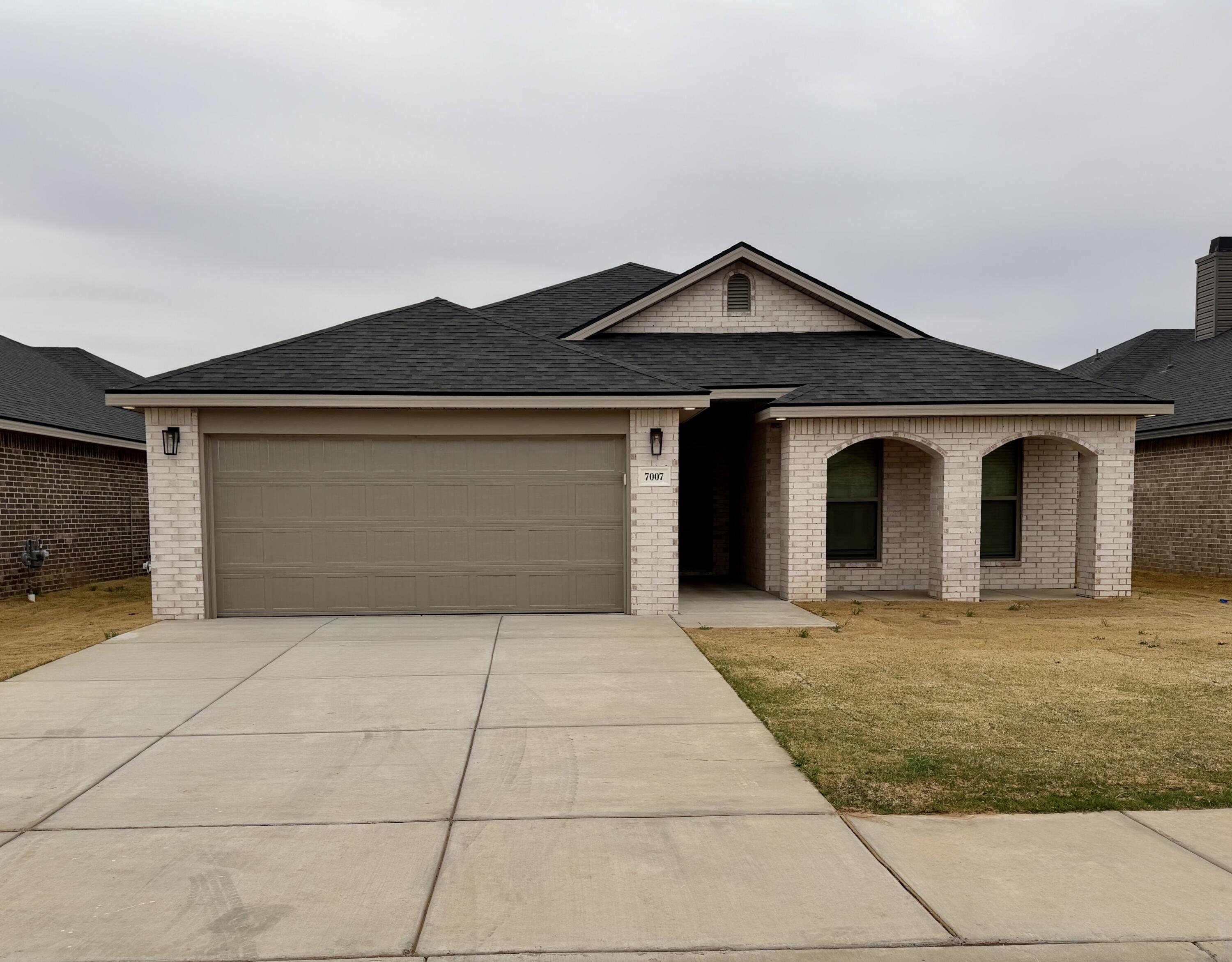 7007 16th Street Lubbock, TX 79416 - Photo 2 of 32 a front view of a house with yard