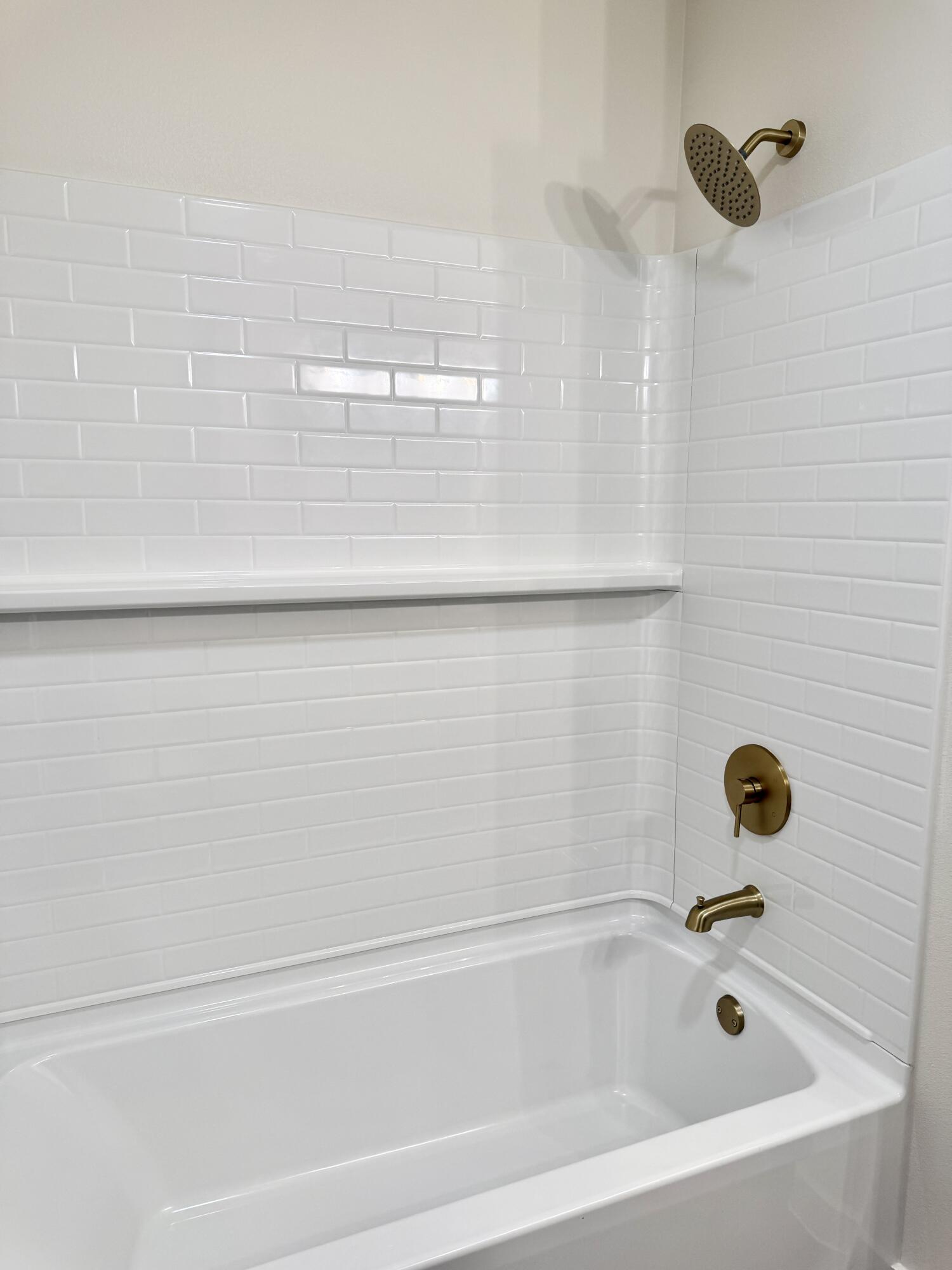 7007 16th Street Lubbock, TX 79416 - Photo 24 of 32 a bathroom with a bathtub