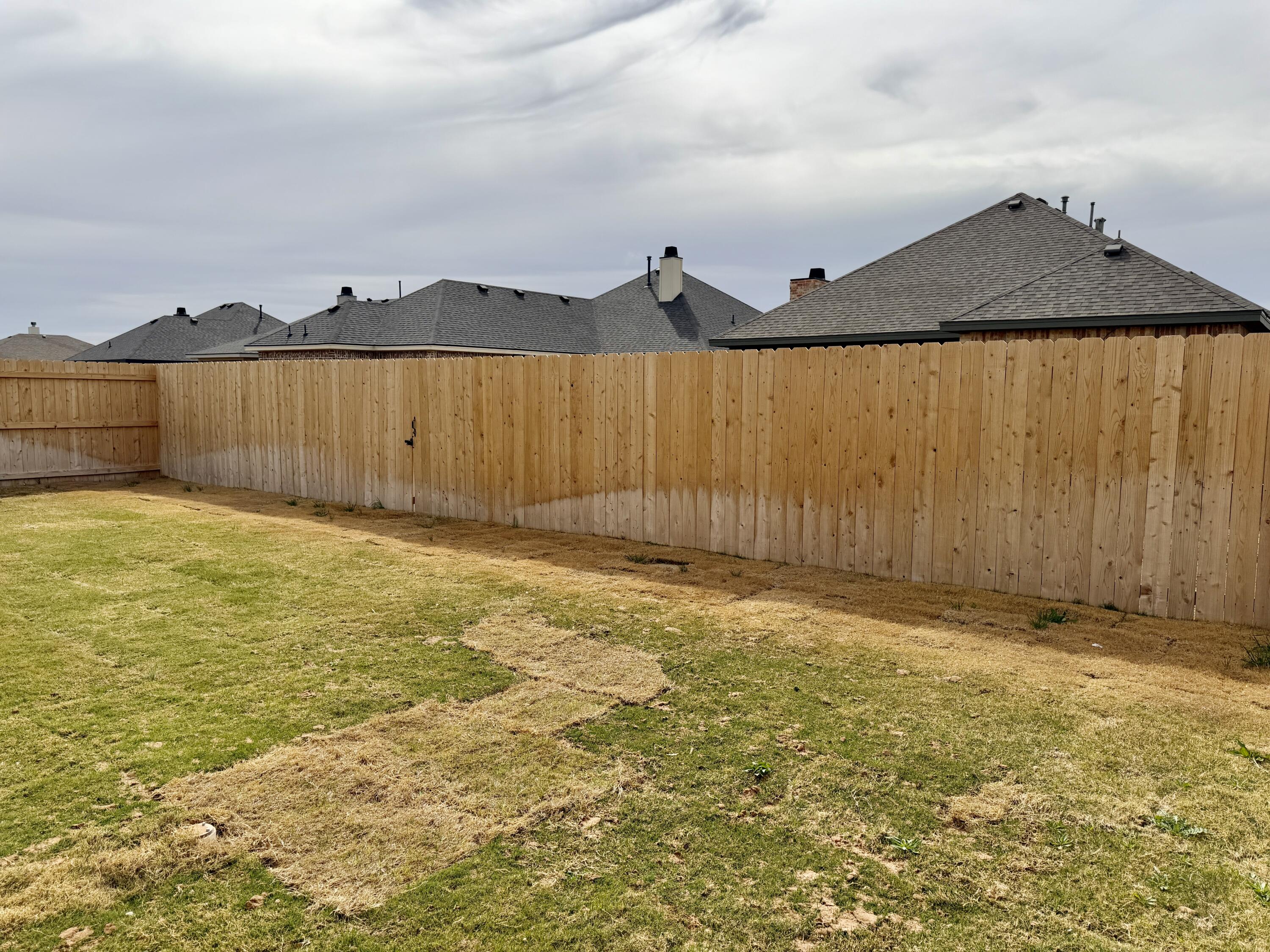 7007 16th Street Lubbock, TX 79416 - Photo 30 of 32 a view of under an umbrella with wooden fence