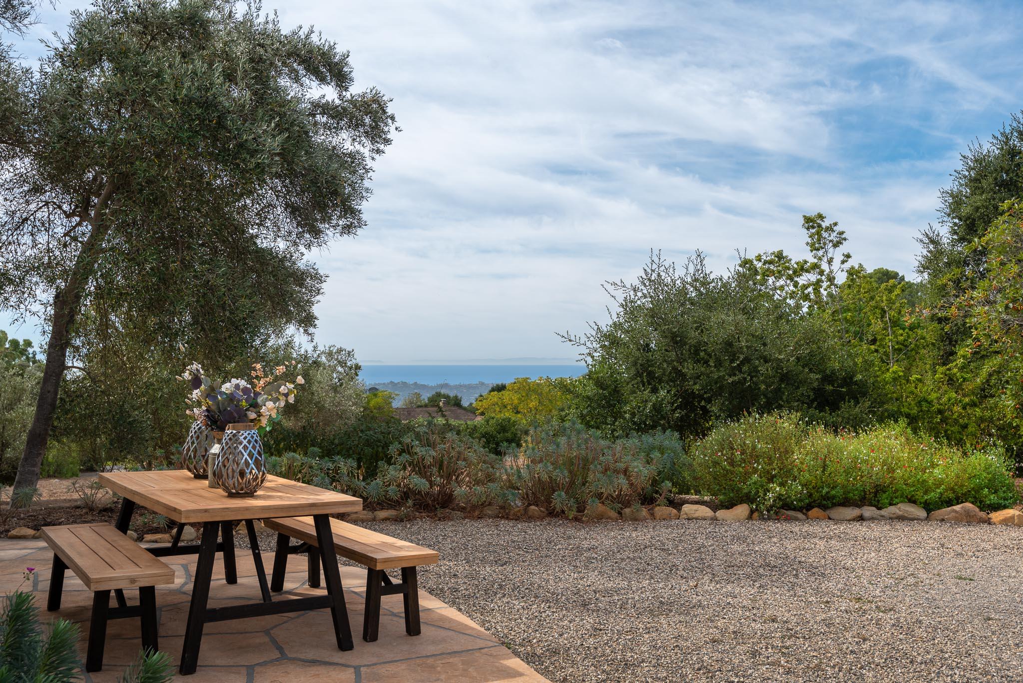 1645 Las Canoas Road Santa Barbara, CA 93105 - Photo 11 of 30 a backyard of a house with table and chairs