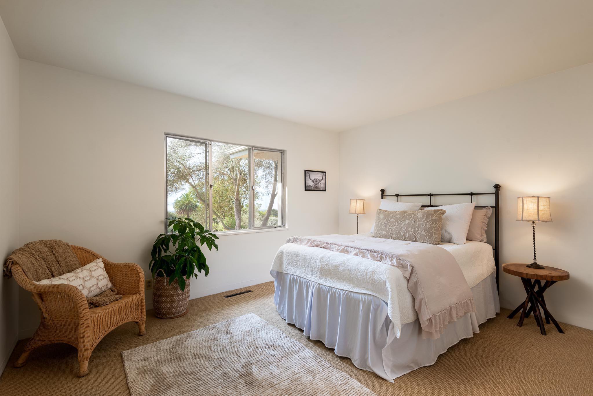 1645 Las Canoas Road Santa Barbara, CA 93105 - Photo 15 of 30 a bedroom with a bed and a couch
