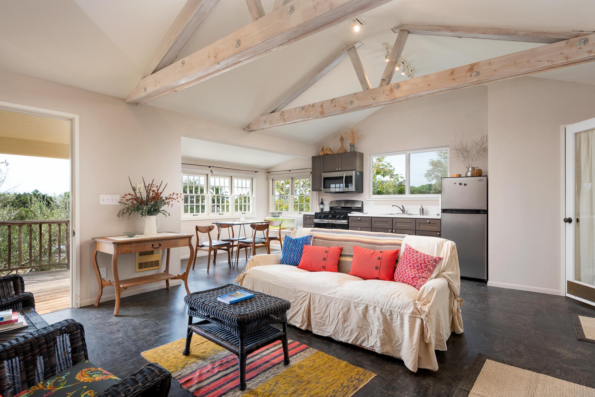 1645 Las Canoas Road Santa Barbara, CA 93105 - Photo 22 of 30 a living room with furniture fireplace and a large window