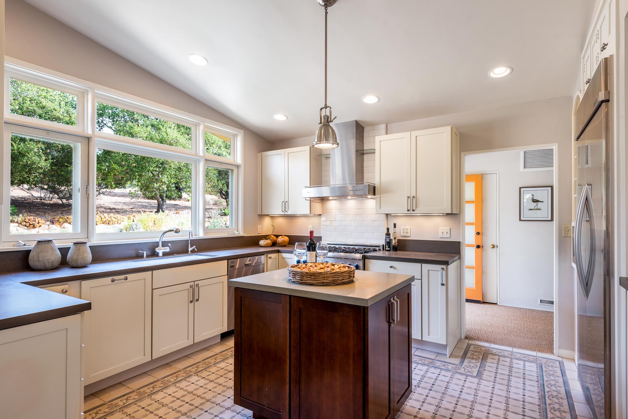 1645 Las Canoas Road Santa Barbara, CA 93105 - Photo 9 of 30 a kitchen with a sink stove and cabinets