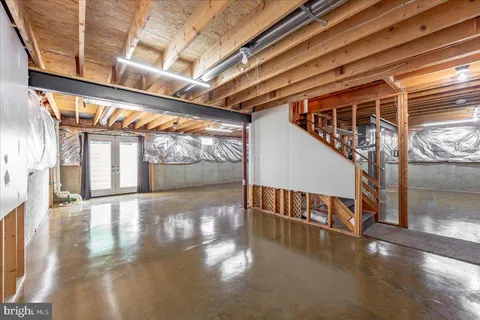a view of an entryway with wooden floor