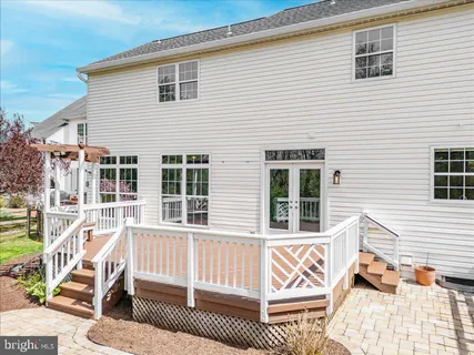 a view of a house with a wooden deck