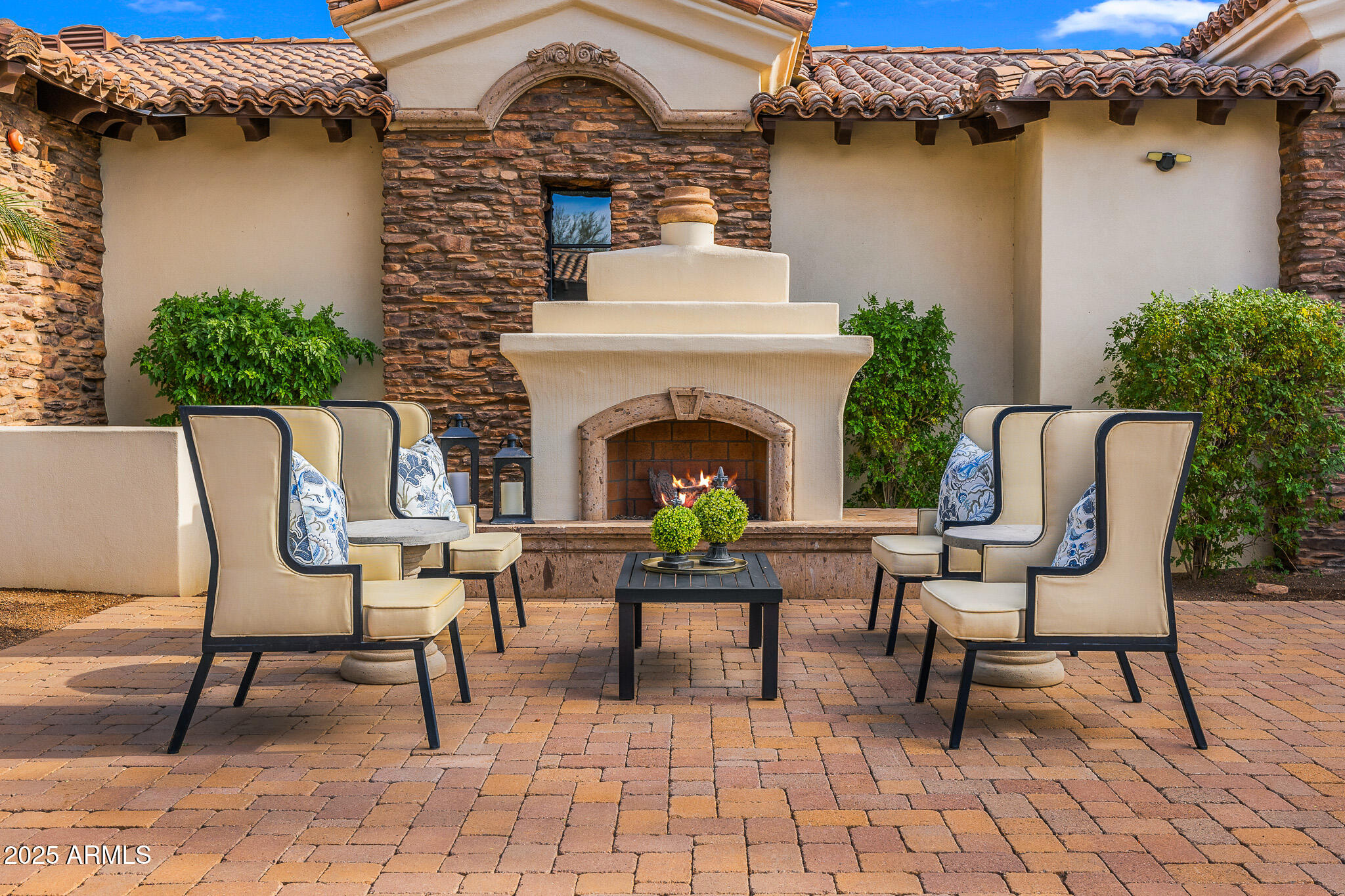 4838 East Palomino Road Phoenix, AZ 85018 - Photo 11 of 26 a view of a chairs and a fireplace in the back of a room