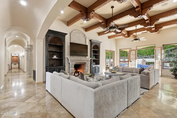 a living room with furniture fireplace and a flat screen tv