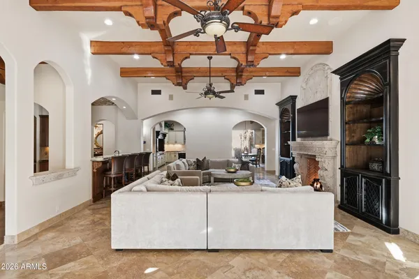 a living room with fireplace furniture and a flat screen tv