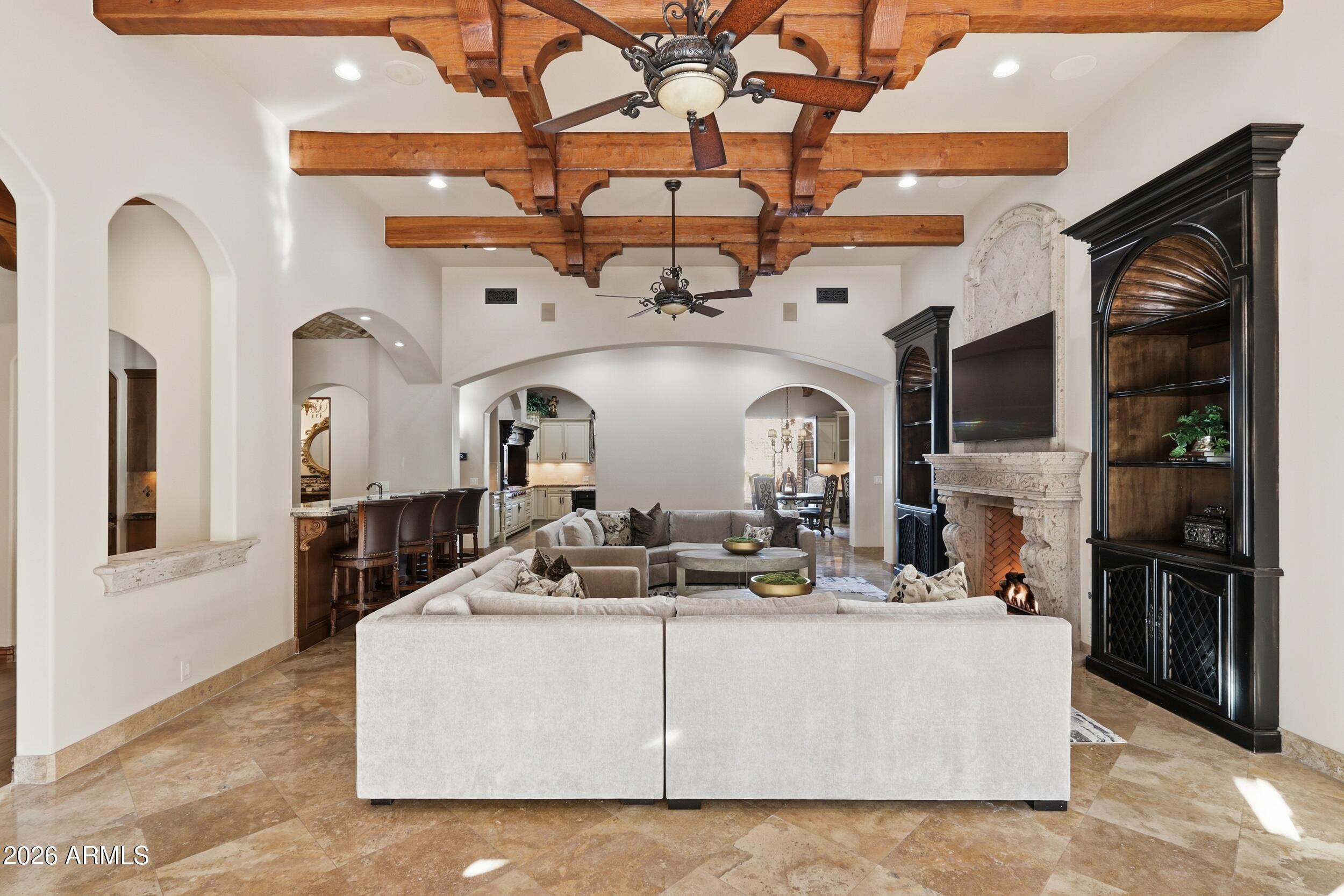 4838 East Palomino Road Phoenix, AZ 85018 - Photo 16 of 37 a living room with fireplace furniture and a flat screen tv