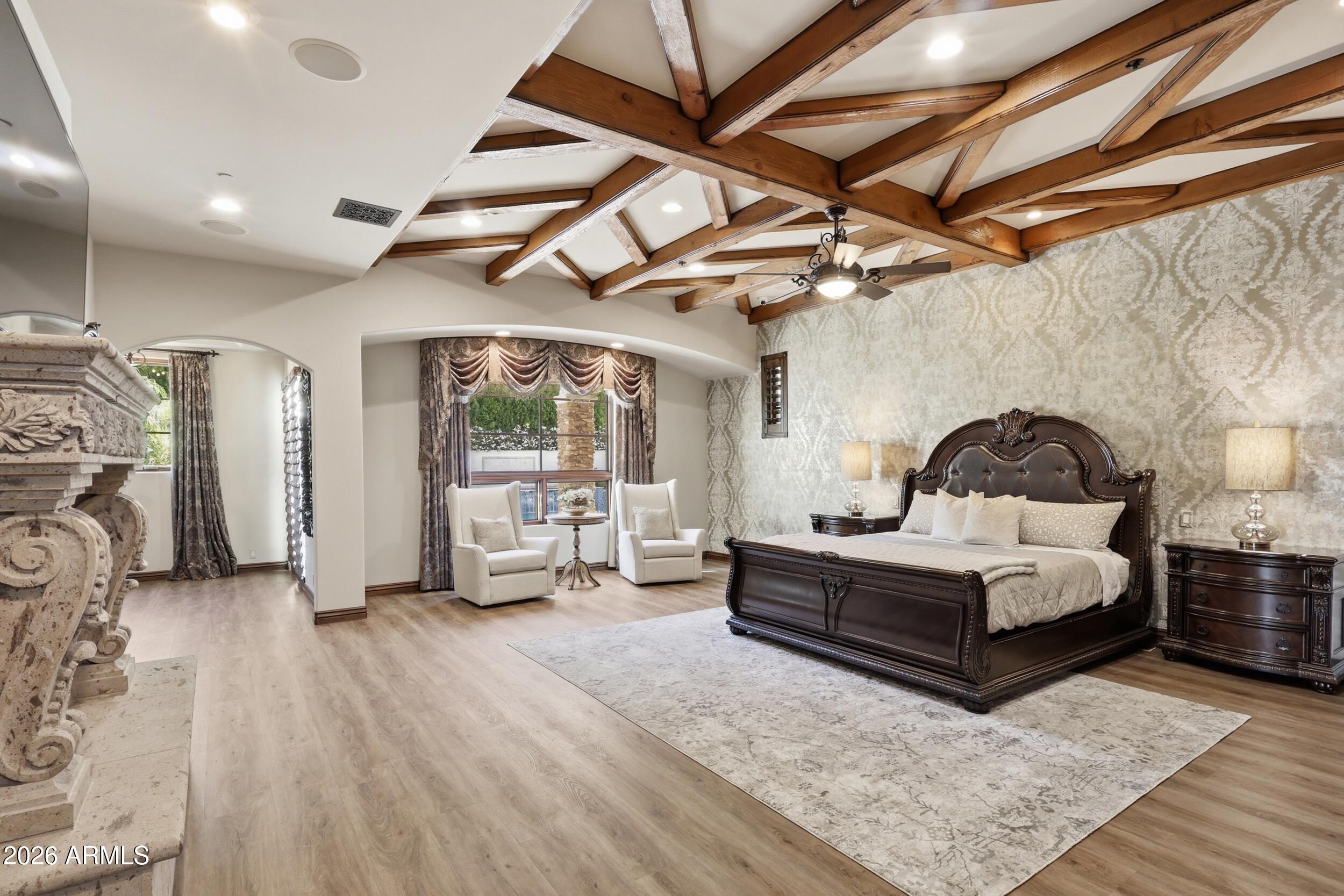 4838 East Palomino Road Phoenix, AZ 85018 - Photo 18 of 37 a living room with furniture and a chandelier