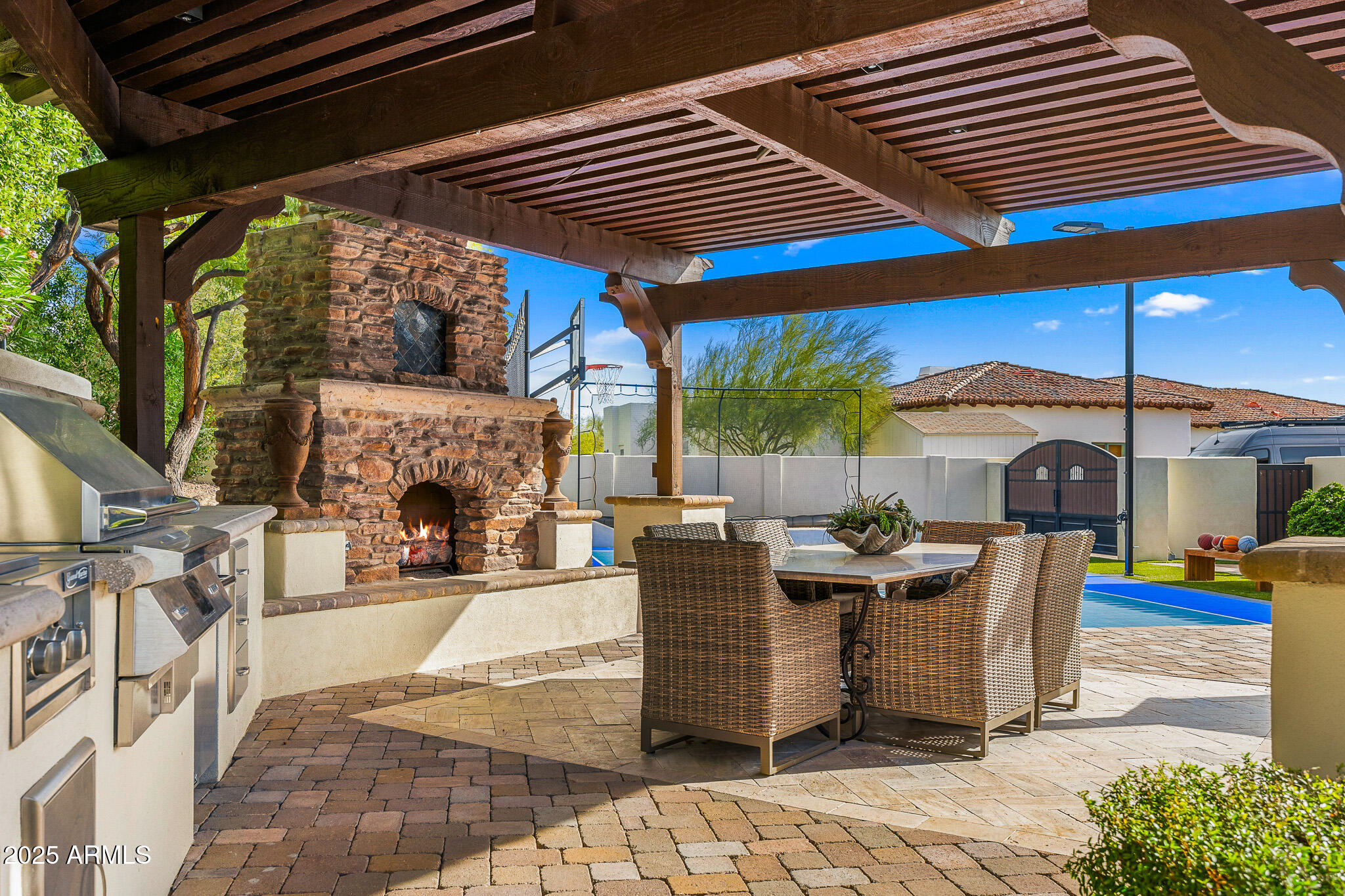 4838 East Palomino Road Phoenix, AZ 85018 - Photo 20 of 26 a view of a patio with table and chairs potted plants