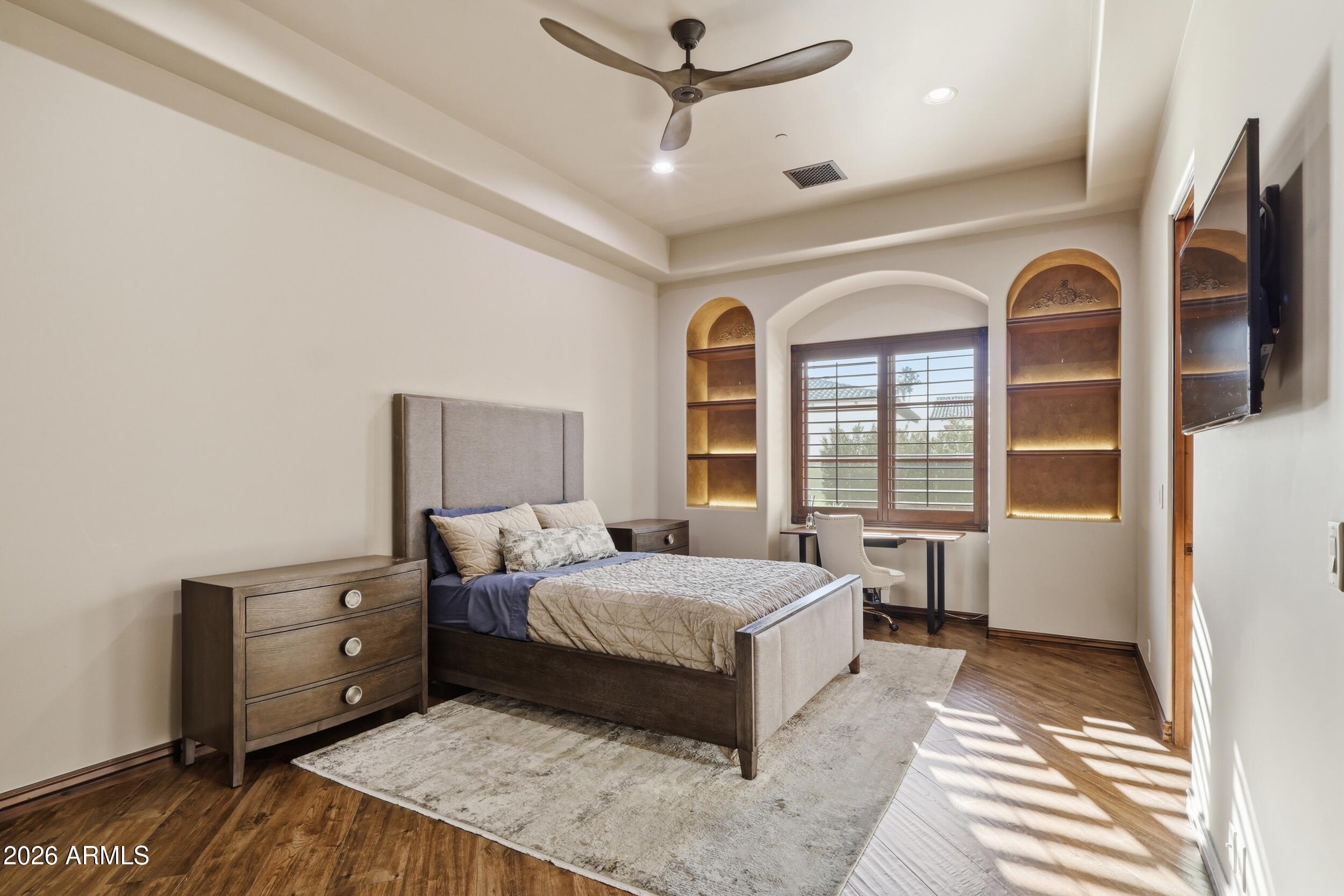 4838 East Palomino Road Phoenix, AZ 85018 - Photo 24 of 37 a living room with a bed and a window