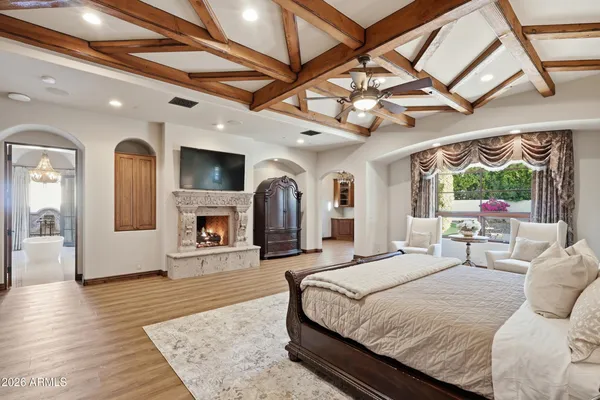 a bedroom with a large bed and a large window