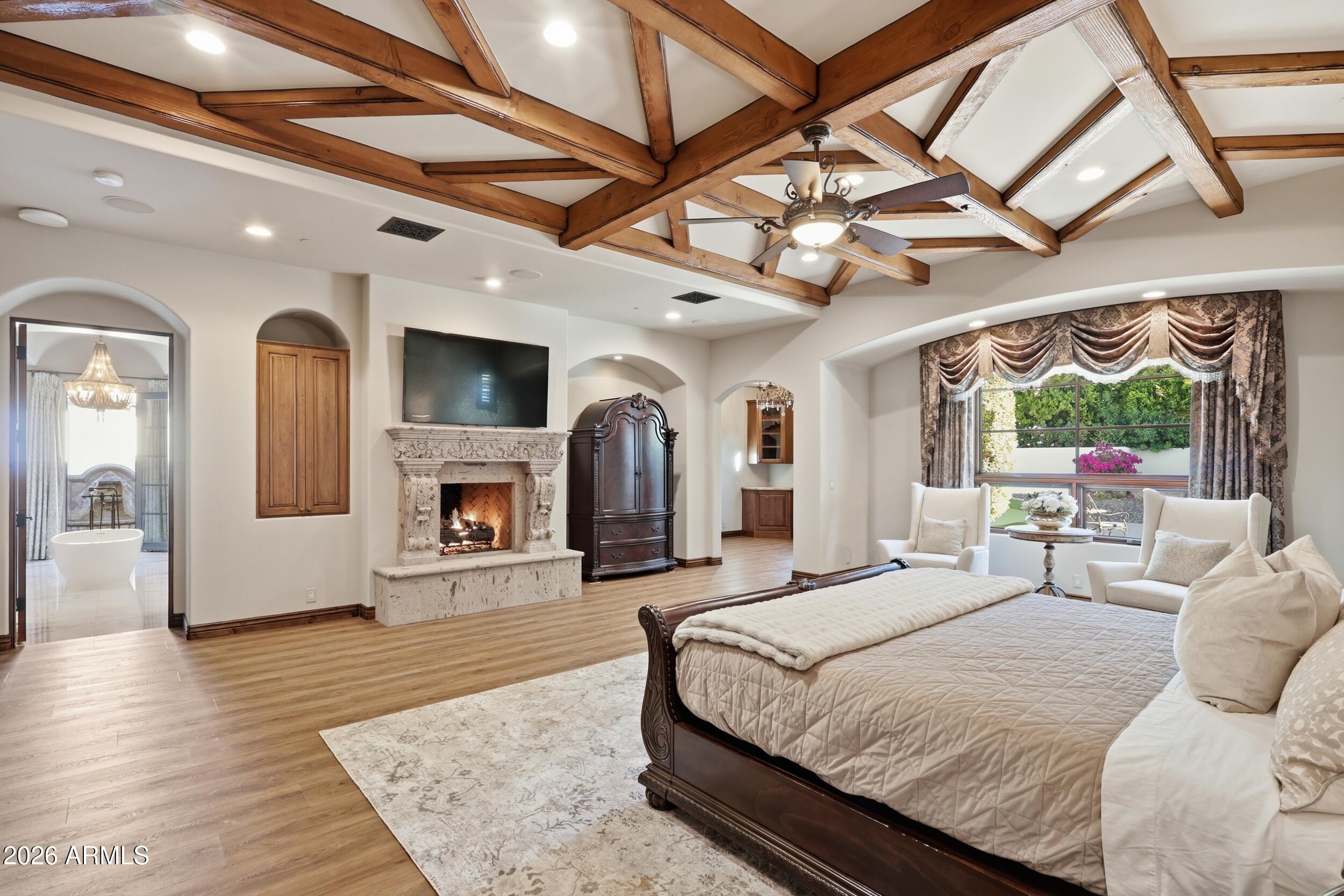 4838 East Palomino Road Phoenix, AZ 85018 - Photo 4 of 37 a bedroom with a large bed and a large window