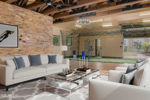 a living room with furniture and a chandelier