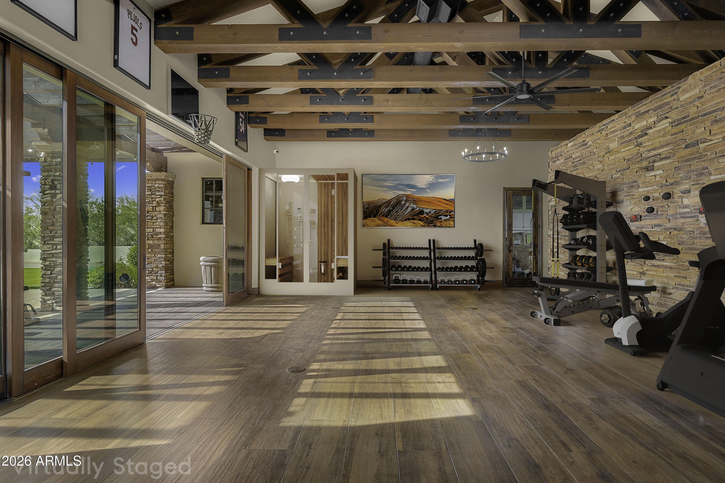 4838 East Palomino Road Phoenix, AZ 85018 - Photo 8 of 26 a view of a hall with wooden floor and windows