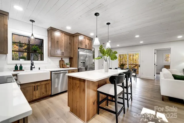 a large kitchen with a table and chairs