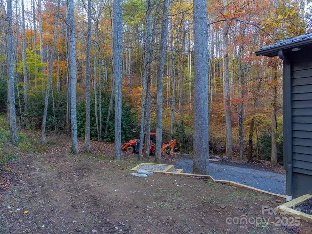 a backyard of a house with lots of green space