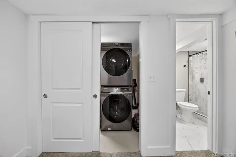 a bathroom with a toilet a sink and a mirror