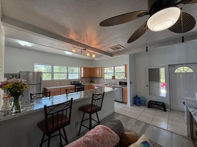 a open kitchen with a table and chairs