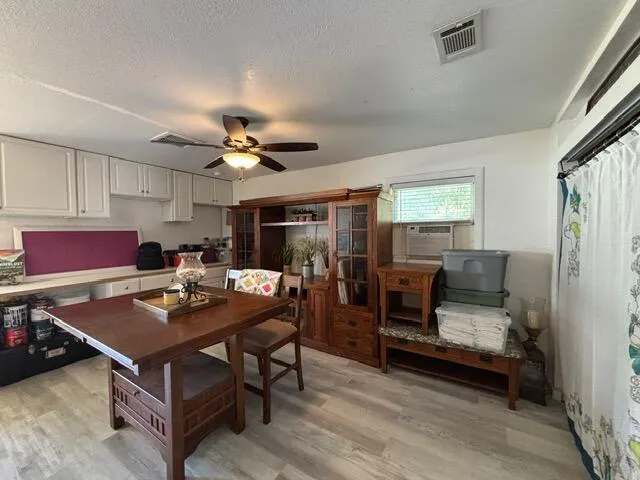 a dining room with furniture and a chandelier