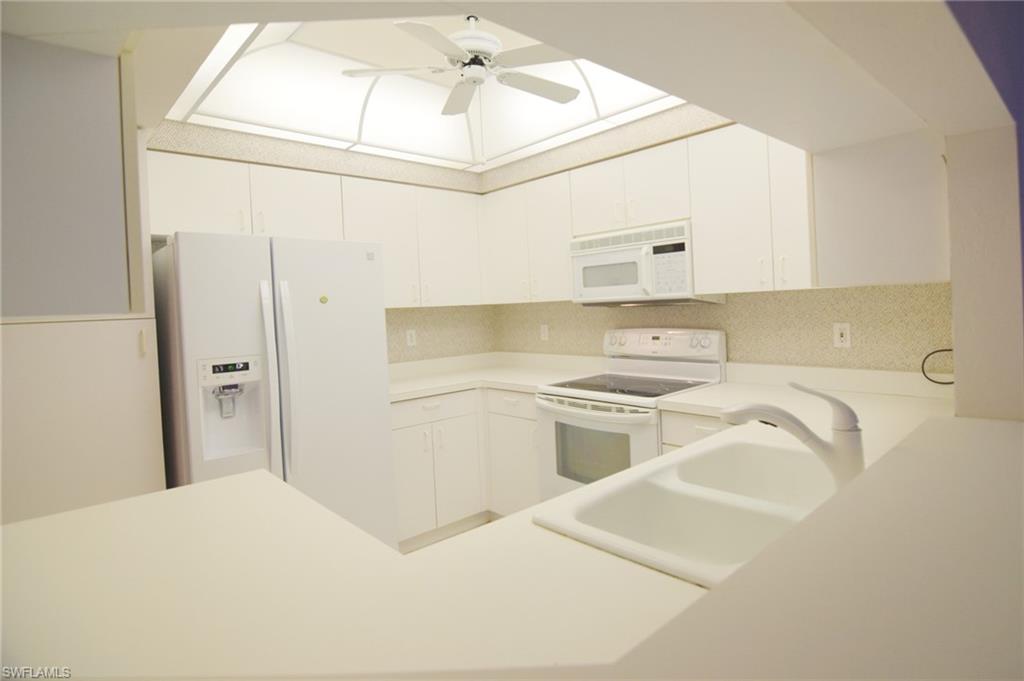 102 Siena Way, Unit 1304 Naples, FL 34119 - Photo 7 of 20 Kitchen Bar View