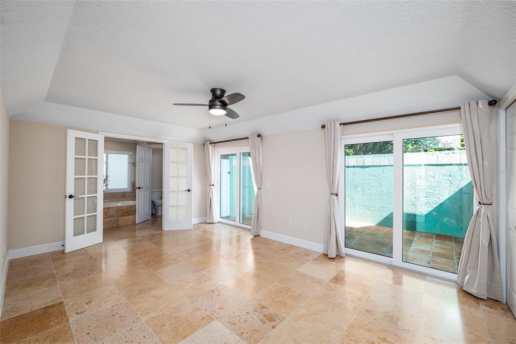 323 North 10th Street Flagler Beach, FL 32136 - Photo 13 of 45 wooden floor in an empty room with a window