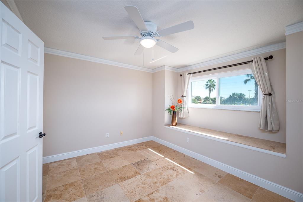 323 North 10th Street Flagler Beach, FL 32136 - Photo 20 of 45 a view of empty room with window and ceiling fan