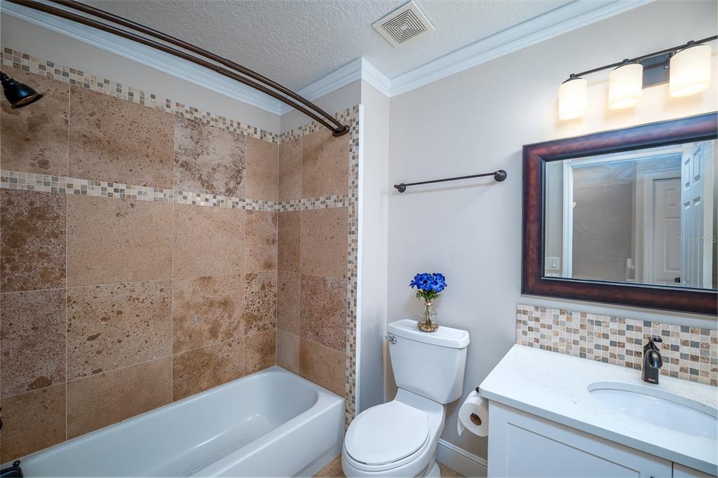 323 North 10th Street Flagler Beach, FL 32136 - Photo 22 of 45 a bathroom with a sink toilet and shower