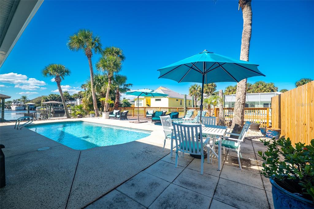 323 North 10th Street Flagler Beach, FL 32136 - Photo 25 of 45 a view of a swimming pool with a patio
