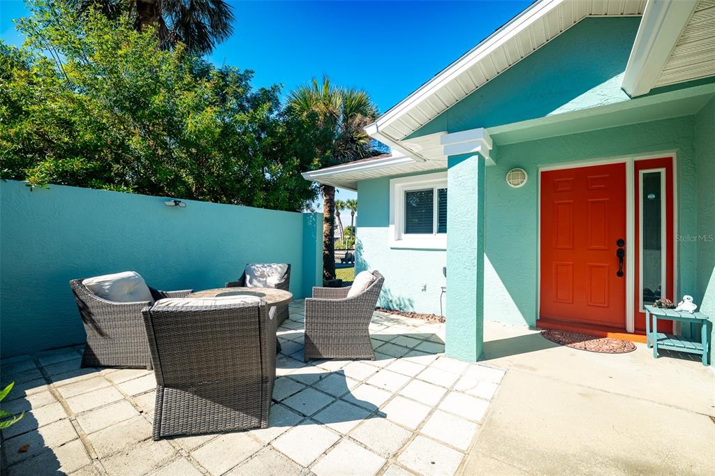 323 North 10th Street Flagler Beach, FL 32136 - Photo 31 of 45 a view of a patio with a table and chairs
