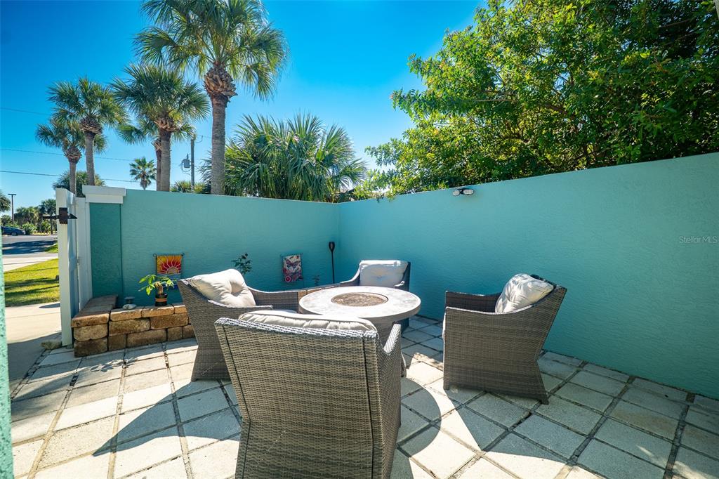 323 North 10th Street Flagler Beach, FL 32136 - Photo 33 of 45 a view of a chairs and table in patio