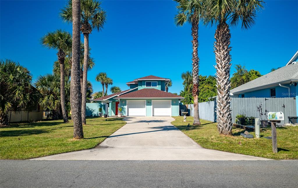 323 North 10th Street Flagler Beach, FL 32136 - Photo 39 of 45 a garden with palm trees