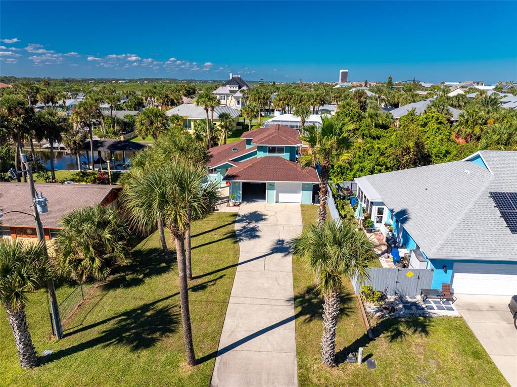 323 North 10th Street Flagler Beach, FL 32136 - Photo 40 of 45 a view of a house with a swimming pool