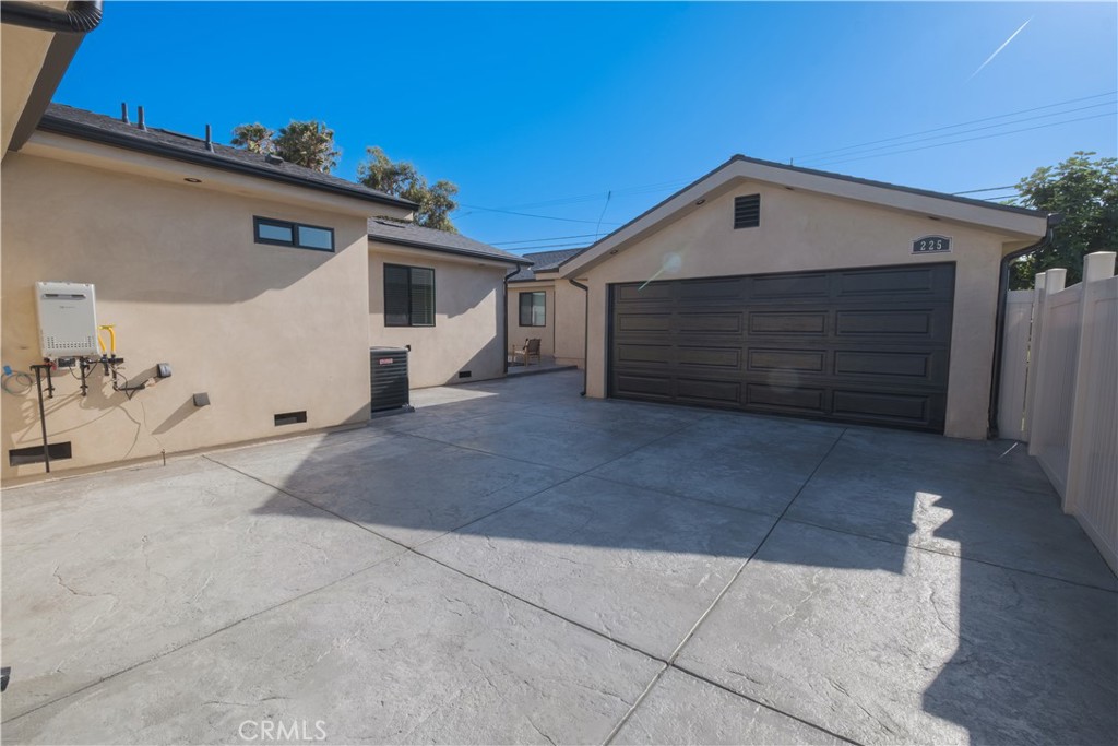 223 South Aprilia Avenue Compton, CA 90220 - Photo 44 of 46 a view of a house with garage