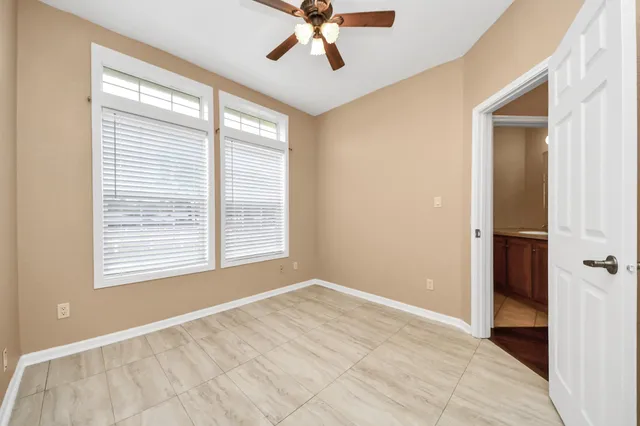 a view of an empty room with a window