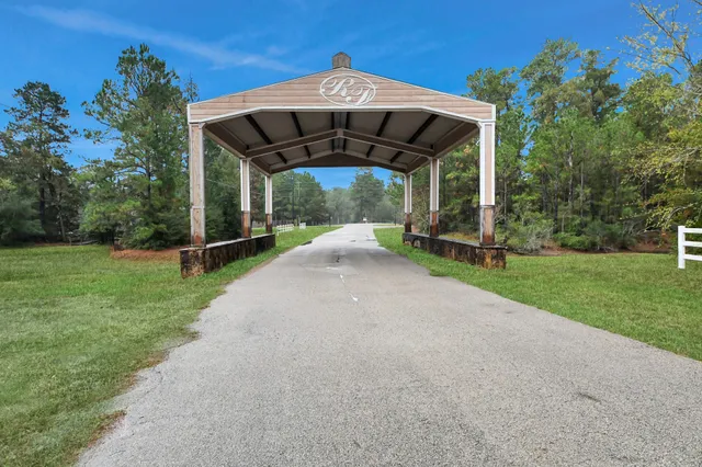 a view of a wooden deck with a yard