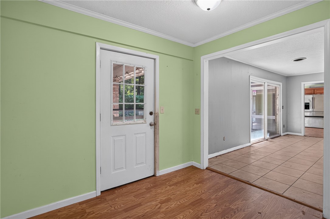 123 Robin Road Westminster, SC 29693 - Photo 37 of 50 A versatile space with varied flooring, featuring a glass-paned door and open entryways.