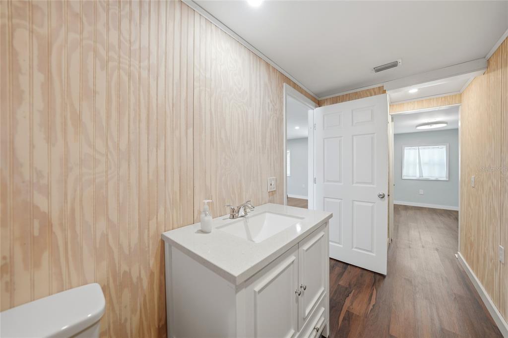 8164 Archie Street Englewood, FL 34224 - Photo 15 of 42 a bathroom with a sink and a mirror