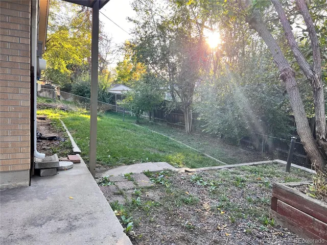 a white bench sitting in middle of forest