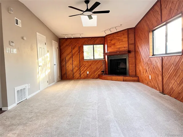 a view of livingroom with fireplace and window